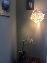 Load image into Gallery viewer, Handmade paper pendant lamp made gives off a warm glow for a special corner.